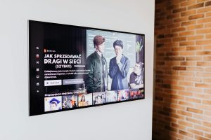 Expert installing a TV wall bracket in a modern Nairobi living room.