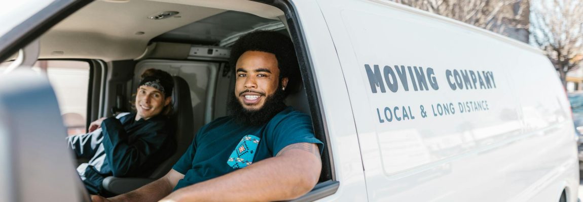 Professional movers loading furniture into a moving truck in Fedha Estate.